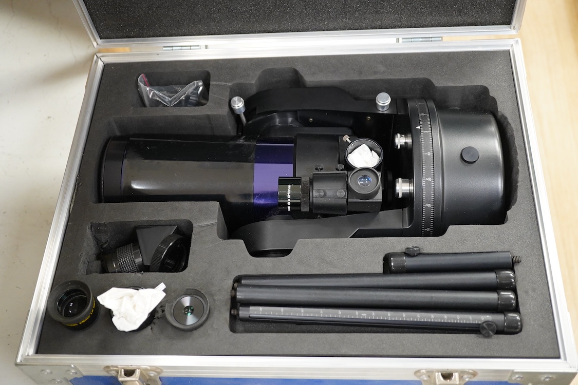 A cased Meade ETX Astro telescope, with instruction manual contained within the original flight case, 46 x 36 x 23cm, together with an additional Orion glass solar filter and tripod